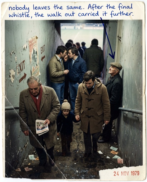Supporters descending a concrete stairwell after the final whistle